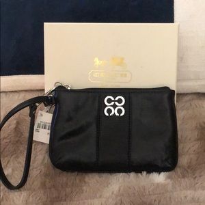 Black leather Coach wristlet